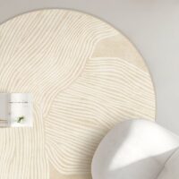 Tapis beige rond motifs lignes abstraites