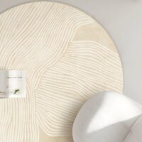 Tapis beige rond motifs lignes abstraites
