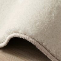 Tapis beige rond motif feuillage poils courts CAMILLE