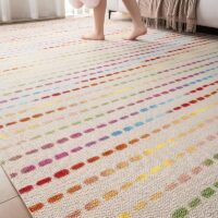 Tapis de jeux pour enfant en laine beige avec traits de couleur BASIL