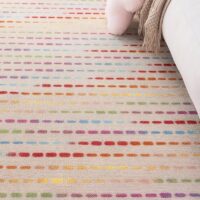 Tapis de jeux pour enfant en laine beige avec traits de couleur BASIL