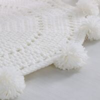 Tapis en laine synthétique tricoté rond avec pompons de décoration KRICHI