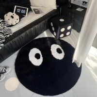 Tapis noir rond avec yeux blancs design et tendance BILE