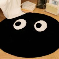 Tapis noir rond avec yeux blancs design et tendance BILE
