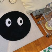 Tapis noir rond avec yeux blancs design et tendance BILE