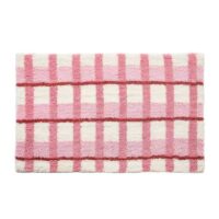 Tapis rose de décoration ou de bain à carreaux avec touche de blanc