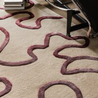 Tapis rose et beige rectangulaire motifs abstraits lignes entrelacées PUXU