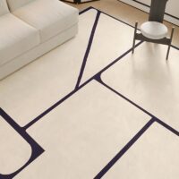 Tapis vintage beige avec motifs géométriques noirs de décoration GILLES